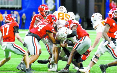 Georgia’s defense made the run game difficult for Texas, holding the Longhorns to just 31 rushing yards. LANCE McCURLEY/Staff