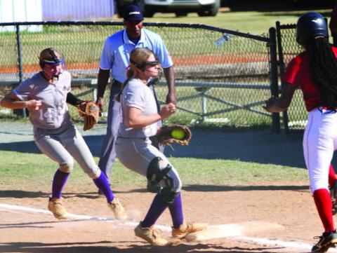 The Lady Greyhounds make the play to get the out and cover first during Friday’s state tournament game against Northside Columbus BRAD HARRISON/Staff