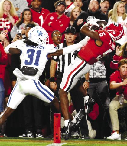 Wide receiver transfer Rara Thomas (5) catches a touchdown pass over a Kentucky defender for Georgia’s second score of the night. BRENDAN KOERNER/Staff