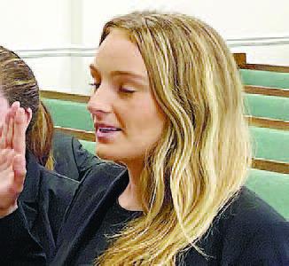 Third-year law student Kigin Hill is sworn in Sept. 1 in Jones County Superior Court. DEBBIE LURIE-SMITH/Staff