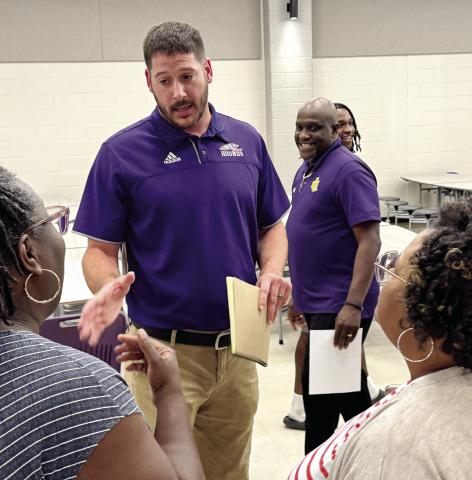 New Greyhounds head basketball coach Dylan Dupree greeted players and parents during Monday night’s meet-and-greet event at the JCHS cafeteria. BRAD HARRISON/Staff