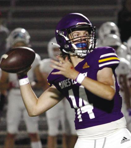 Quarterback Cason Taylor looks downfield before letting loose a pass near the end of Friday’s scrimmage. BRAD HARRISON/Staff