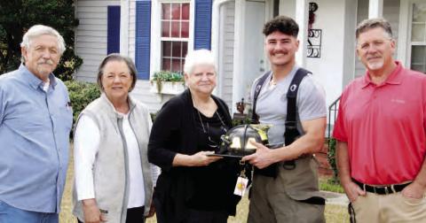 Woodmen Life Chapter 542 presented a Phoenix fire helmet to firefighter Lucas Garrett Kitchens. Garrett is the grandson of chapter president Chris Smarr. Pictured are (l-r): Fred and Teresa Allen, Chis Smarr, Lucas Garrett Kitchens and Heath Green. CONTRIBUTED
