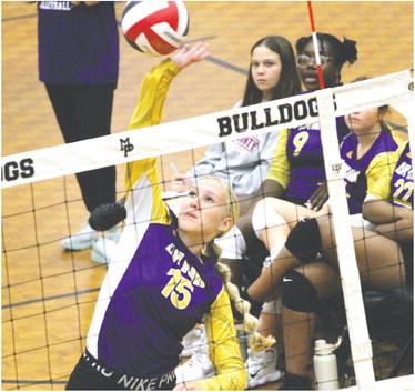 Kamryn Hardwick spikes an opposing shot to the other side of the net against Mary Persons. BRAD HARRISON/Staff