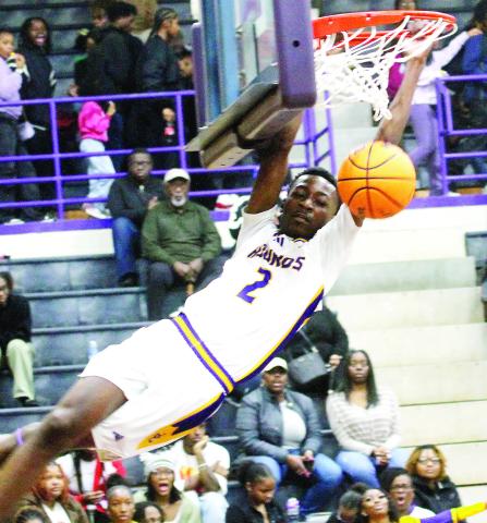 Rudy Bowden gets some hang time after a first-half slam dunk against Southwest. BRAD HARRISON/Staff