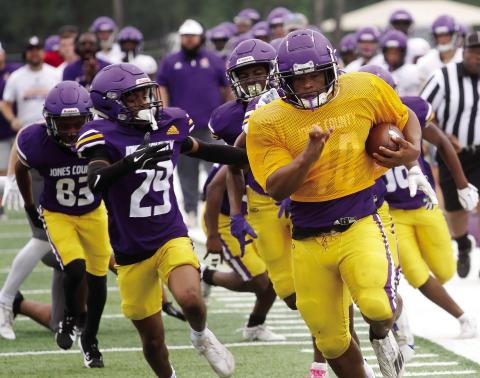 Brandon Jones (40) gets loose for a run down the sidelines during Saturday morning’s J-Day game. BRAD HARRISON/Staff