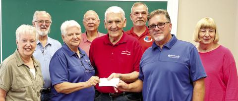 Woodmen LIfe Chapter 542 representatives President Chris Smarr (3rd left) and Sales Representative Heath Green (2nd right) present a check to the Jones County Veterans Committee at their Oct. 16 meeting. DEBBIE LURIE-SMITH/Staff