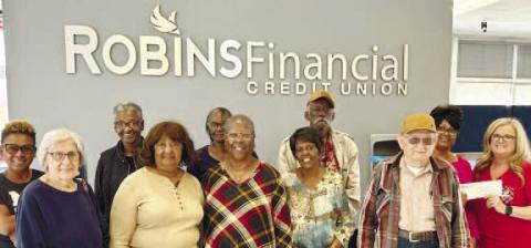 Senior Center receives their 25 Days of Holiday Giving check.