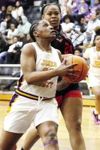Kamiyah Adams drives the lane to score two points during the Lady Hounds’ first-round win against Cedar Shoals. BRAD HARRISON/Staff