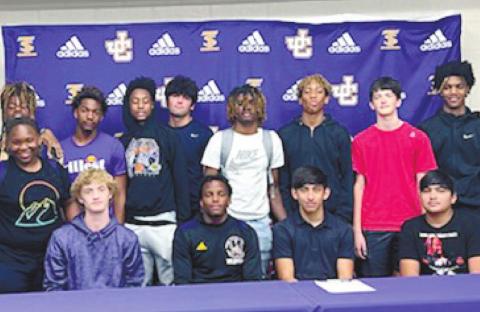 Matt Wold is joined by his teammates following his scholarship signing with Denmark Tech. CONTRIBUTED
