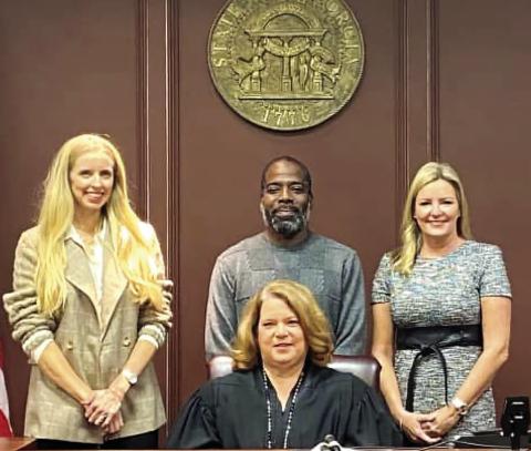 On December 9, Ocmulgee Court Appointed Special Advocates (CASA) swore in three new volunteers who will advocate for children in foster care. Pictured with Juvenile Court Judge Kelli Rutherford are (L-R); Laney Crowder, Daylon Martin and Allison Shepherd. The next new volunteer training is in February 2025. Please call 478-452-9170 for details. CONTRIBUTED