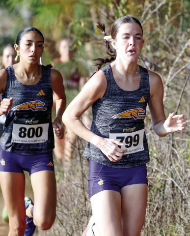 Addison Robinson, right, and Isabella Sanchez set an early pace during Saturday’s girls AAAA sectional. BRAD HARRISON/Staff