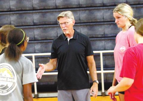 Greyhounds head coach Lonnie Wheeler directs his varsity players during a preseason practice. BRAD HARRISON/Staff