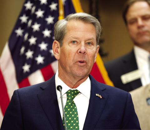 Gov. Brian Kemp speaks before signing Georgia House Bills 1199 and 1000 into law at the Georgia State Capitol on Friday, March 20, 2026. The laws suspend the state motor fuel tax for 60 days and implement one-time income tax rebates. ASHTIN BARKER/Capitol Beat