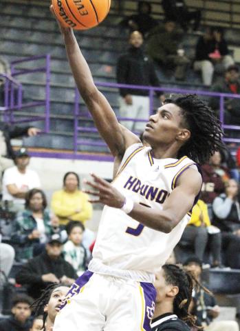 Jaden Stanley goes in uncontested for a layup against Eagles Landing. BRAD HARRISON/Staff
