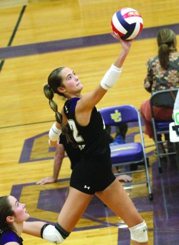Becca Durrett lifts the ball over the net against ACE. BRAD HARRISON/Staff