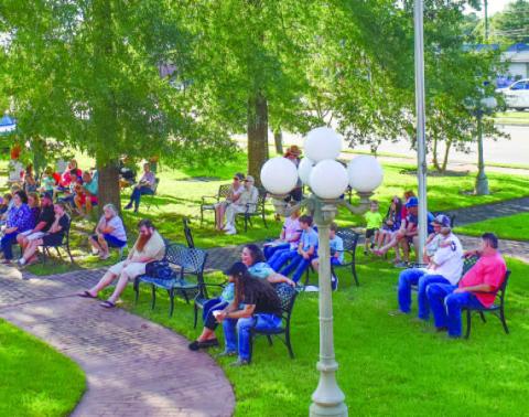 Families at Carol’s Park gather to read and listen as the entirety of the Bible is read. CONTRIBUTED