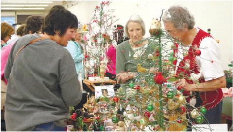 A photo from Christmas on Main in 2018, showing people shopping for Christmas decorations. FILE PHOTO