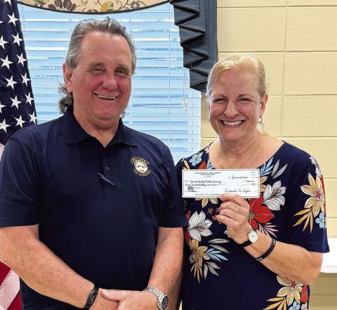 The Jones County Public Library extended its appreciation to the Kiwanis Club of Jones County for its donation. Pictured is Bill Goodman, vice president, presenting the check to Julie King, branch manager. CONTRIBUTED