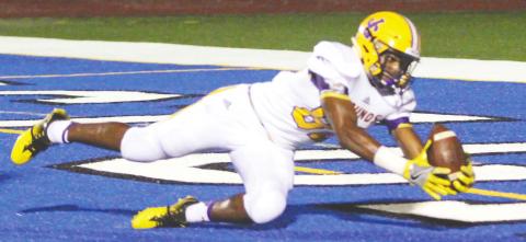 De’Queze Fryer hauls in a touchdown pass during a 2017 game for the Greyhounds. FILE PHOTO