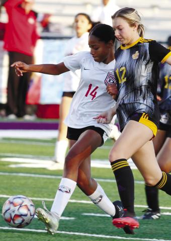 Taylor Nipper fights for position on the ball against Dutchtown. BRAD HARRISON/Staff