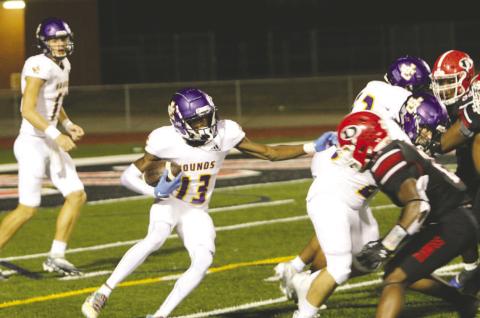Zion Ragins looks for an opening as he picks up hard-earned yardage against Dutchtown. BRAD HARRISON/Staff