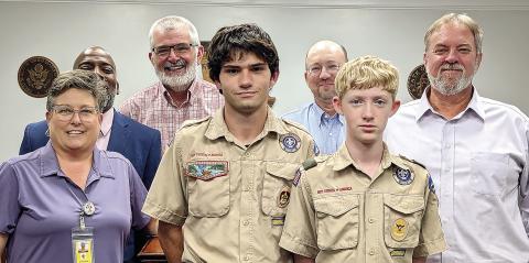 Scouts from Jones County Troop 485, Joshua Dreher and Christian Spires, led the opening prayer and pledge at the Aug. 5 meeting of the Jones County Board of Commissioners. Contributed