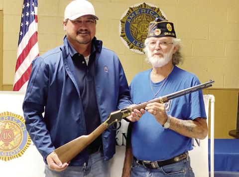 Chris Taylor (left) of Cordele was the winner of the lever action Henry Golden Boy rifle, which was donated to American Legion Post 142 by Scott Walston of Gray Memorial Chapel. DEBBIE LURIE-SMITH/Staff