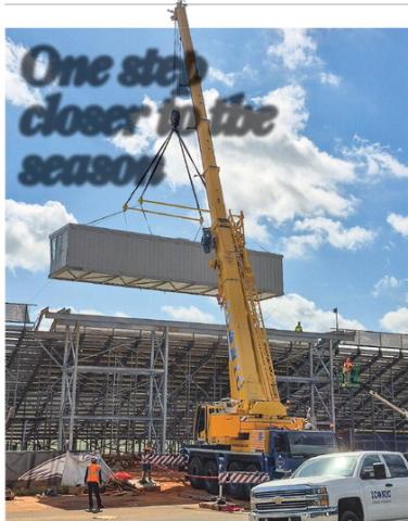 Parrish Construction and Iconic Crane and Rigging companies work together to get the new press box placed at the top of the bleachers of Jones County’s Greyhound field Friday morning. CONTRIBUTED