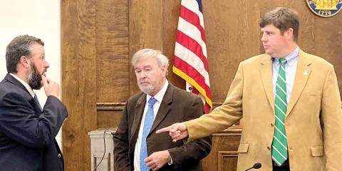 District Attorney Wright Barksdale (right) speaks with probation supervisor Jesse Gibbs (left) and public defender Tom O’Donnell during a break. DEBBIE LURIE-SMITH /Staff