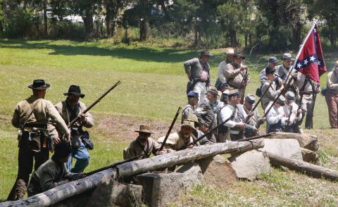 Confederate soldiers prepare for battle during War Days. FILE PHOTO