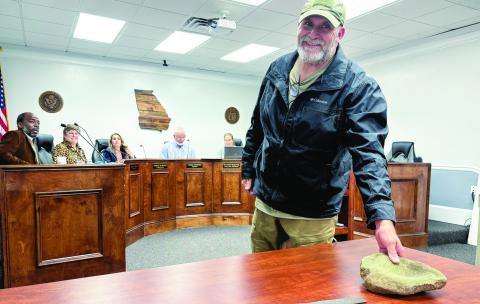 John Simmons brings artifacts he found while working on the Jakes Woods property to the Nov. 18 BOC meeting. DEBBIE LURIE-SMITH/Staff