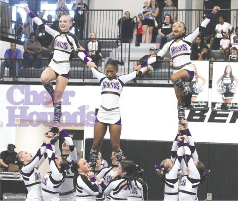 Jones County’s Competition Cheerleaders execute a stunt during Saturday’s competition in Houston County. 
