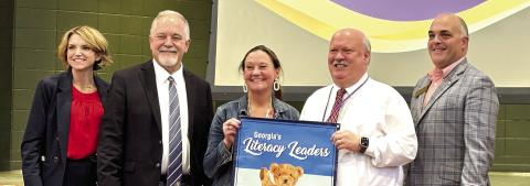 Dames Ferry Elementary Principal Wes Cavendar and Asst. Principal Kristin Jones accept their school’s award. DEBBIE LURIE-SMITH/Staff