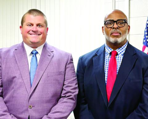New Clifton Ridge Principal Chance Scott (lleft) and Interim School Superintendent Clinton Burston after the July 11 called meeting. DEBBIE LURIE-SMITH /Staff