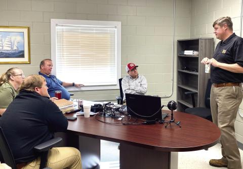 Ocmulgee Circuit District Attorney Wright Barksdale (far right) meets with investigators of the Jones County Sheriff’s Office in their conference room Nov. 8 to discuss current cases and their prosecution. DEBBIE LURIE-SMITH/Staff