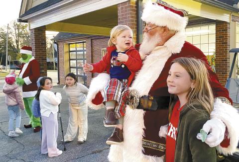 Gray’s Downtown Christmas Market Nov. 30 featured both Santa and the Grinch with a day filled with shopping, good food and even an outdoor wrestling match. DEBBIE LURIE-SMITH/Staff