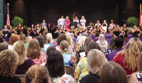 Teachers and school staff members are recognized for their years of service as the convocation program for the new school year concludes. CONTRIBUTED