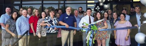 Alex Smith cuts ribbon at law office in Gray