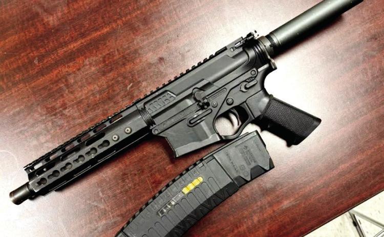 An American Tactical 5.56 pistol with over 40 rounds of ammunition was found on the rear seat of the Altima. CONTRIBUTED
