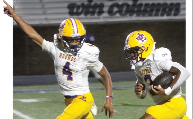 Kaden Canty (3) breaks away for a first-quarter touchdown as Travis Miller celebrates in stride during Friday’s win at Burke County. SEE FULL COVERAGE >> PAGE B1 BRAD HARRISON/Staff