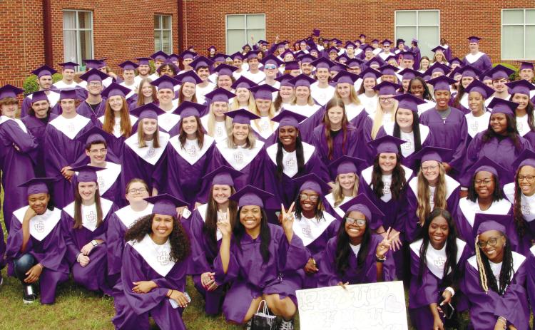 Jones County High School Class of 2023 gather in front of Gray Station Middle School before visiting inside the school during the May 12 Grad Walk. CONTRIBUTED