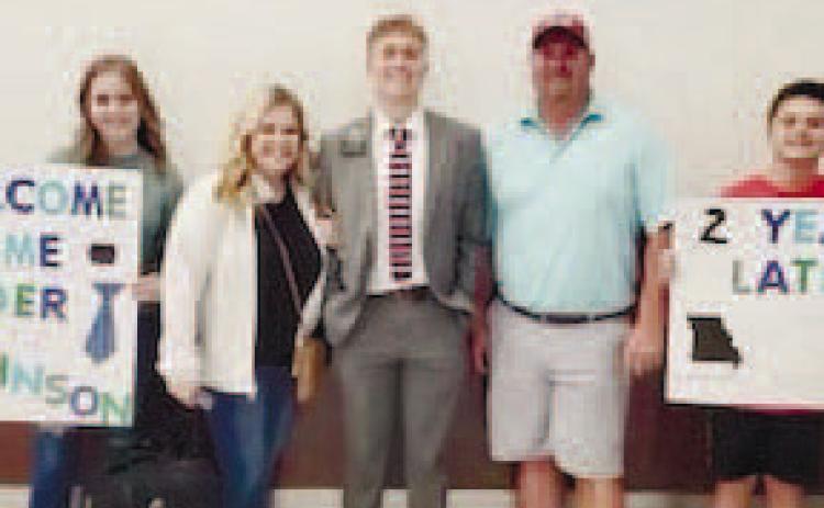 Nicholas Johnson, a young missionary from Jones County who recently returned home, with his family at the airport. CONTRIBUTED