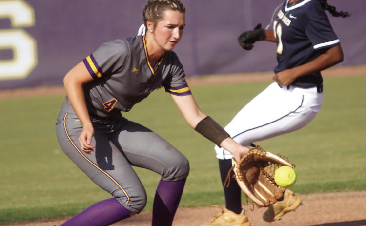 Raylee Harris snags the throw from the middle of the infield in last week’s 19-1 win. BRAD HARRISON/Staff
