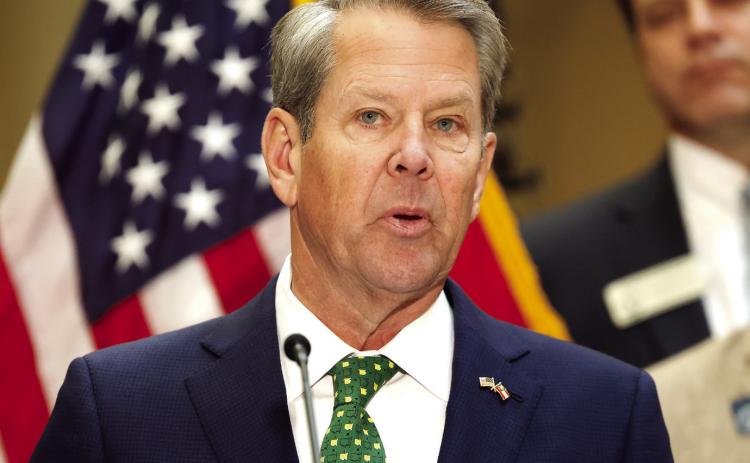 Gov. Brian Kemp speaks before signing Georgia House Bills 1199 and 1000 into law at the Georgia State Capitol on Friday, March 20, 2026. The laws suspend the state motor fuel tax for 60 days and implement one-time income tax rebates. ASHTIN BARKER/Capitol Beat